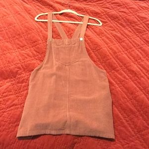 Faded pink corduroy overall dress